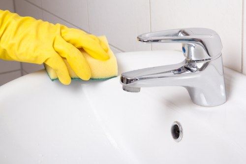 End of tenancy cleaner preparing a Holland Park rental property for checkout